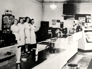 black and white of girls at the counter